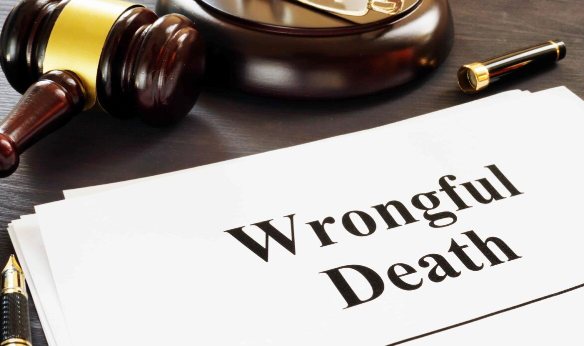 Wrongful death lawsuit documents with judge’s gavel and pen on desk. Wrongful death lawsuit documents with judge’s gavel and pen on desk.