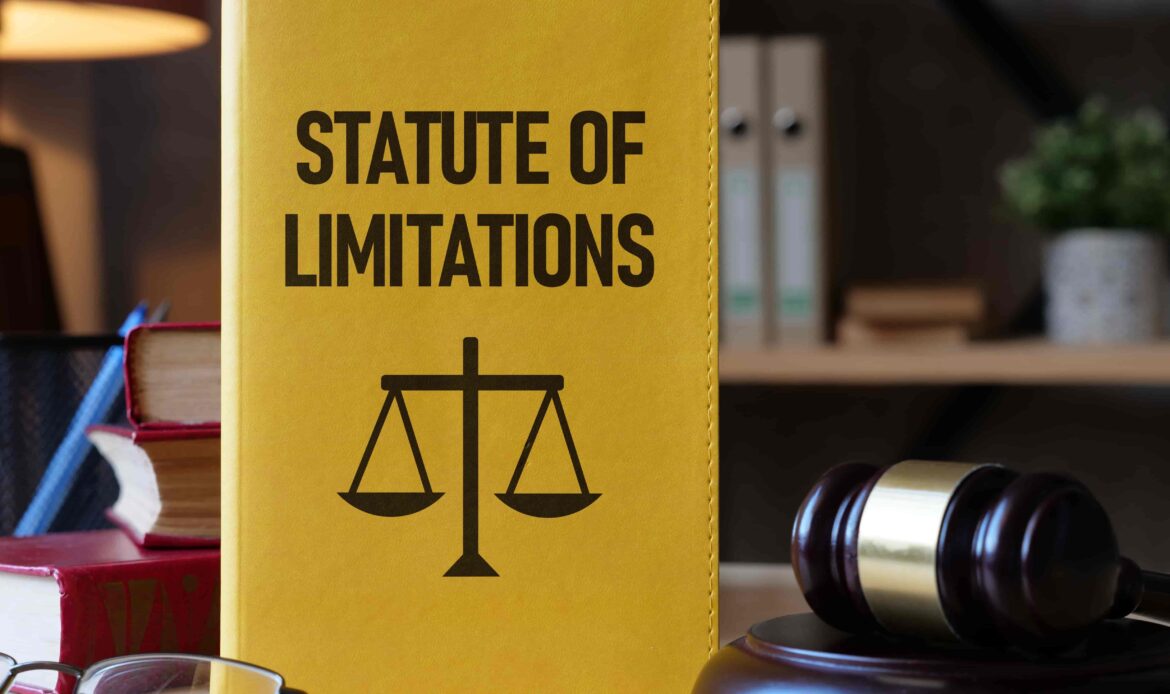 Law book titled Statute of Limitations with justice scale symbol and judge’s gavel on desk. Law book titled Statute of Limitations with justice scale symbol and judge’s gavel on desk.
