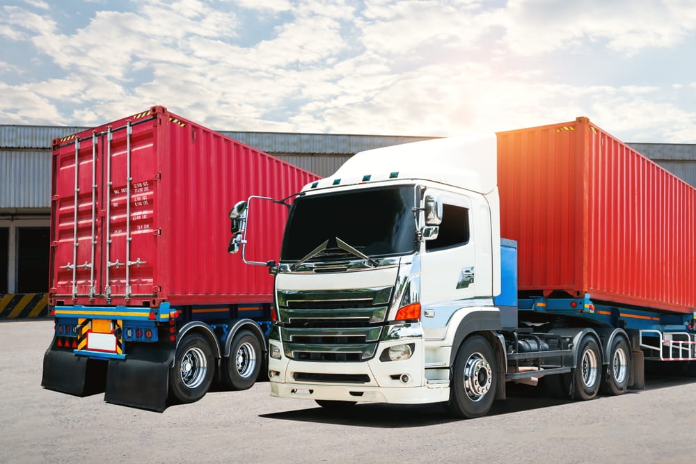 Commercial semi-truck with cargo containers illustrating employer liability in Austin truck accident cases