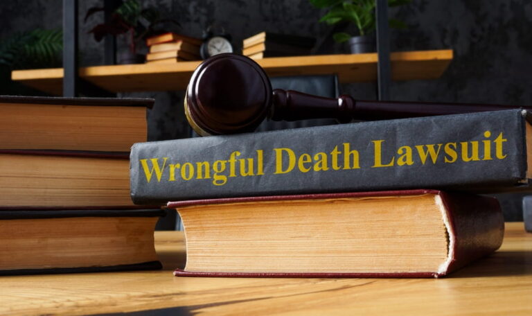 Law book labeled wrongful death lawsuit with gavel representing legal claim after fatal car accident
