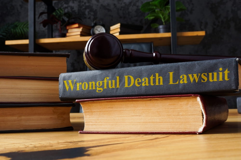 Law book labeled wrongful death lawsuit with gavel representing legal claim after fatal car accident