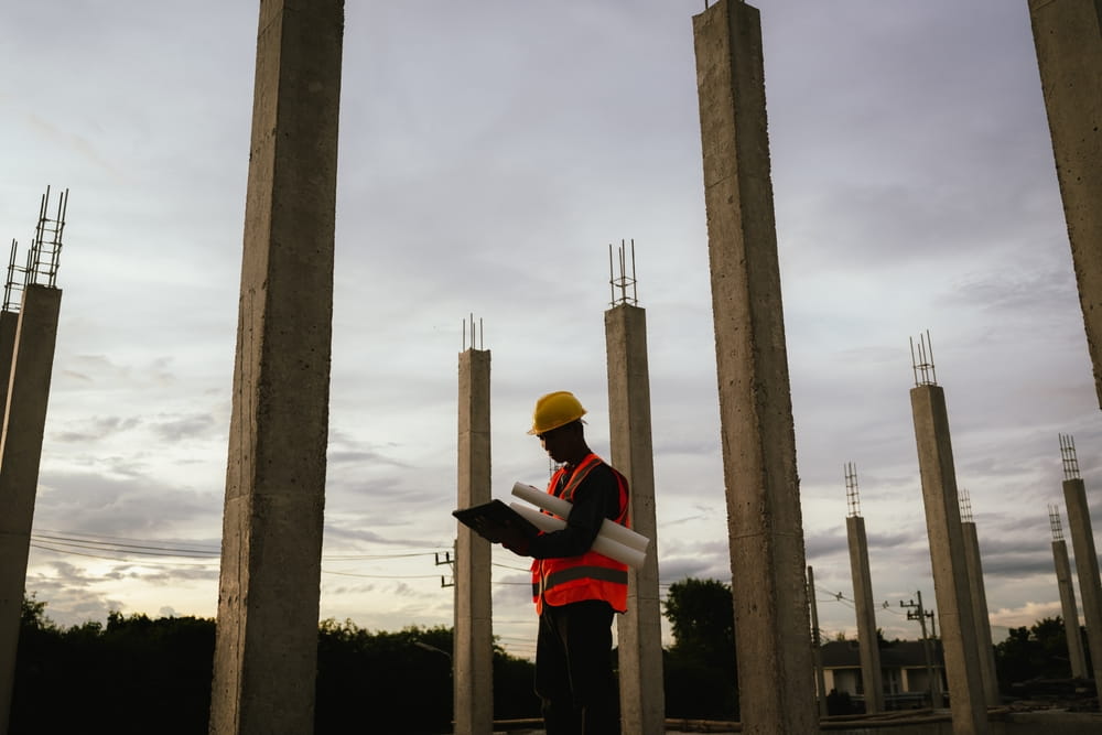 Construction worker on elevated structure illustrating fall risk and liability in Austin