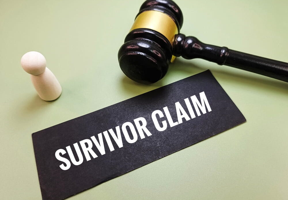 Gavel and sign reading survivor claim representing a survival action lawsuit brought by an estate in Texas