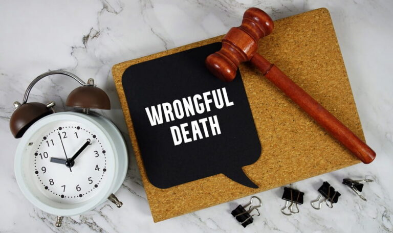 Gavel and sign reading wrongful death representing a legal claim filed by family members after a fatal accident in Texas