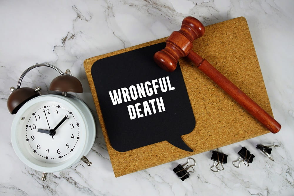 Gavel and sign reading wrongful death representing a legal claim filed by family members after a fatal accident in Texas
