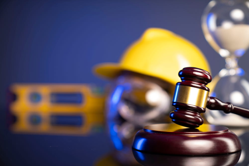 Construction safety equipment and legal gavel representing Colorado construction injury claims