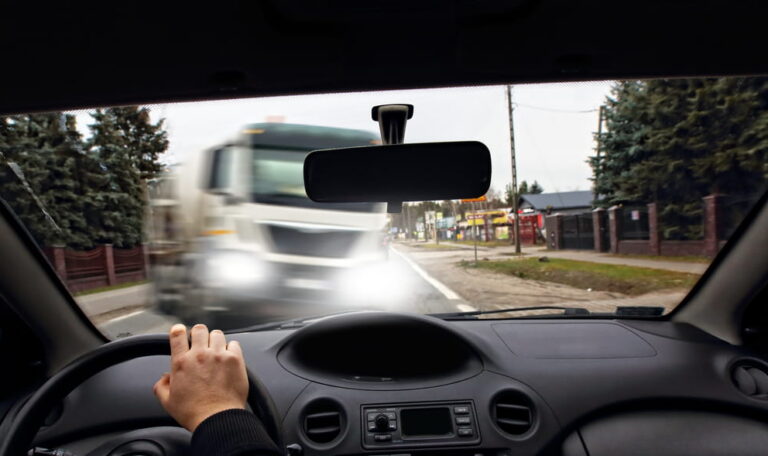 Driver approaching a potential collision with a commercial truck