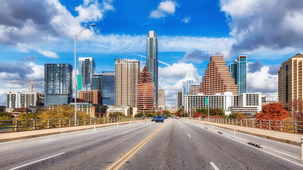 Road leading toward the Austin skyline along the I-35 corridor