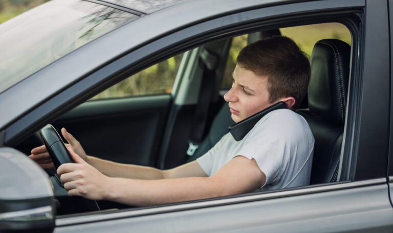 Distracted driver using a phone while driving, a common factor in rideshare accident disputes