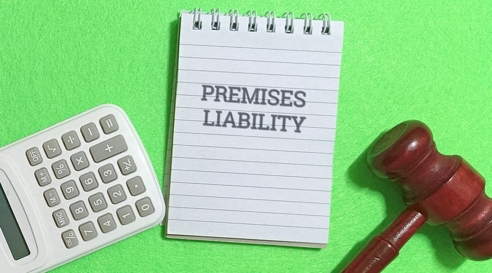 Premises liability legal concept with gavel and notes about property owner responsibilities