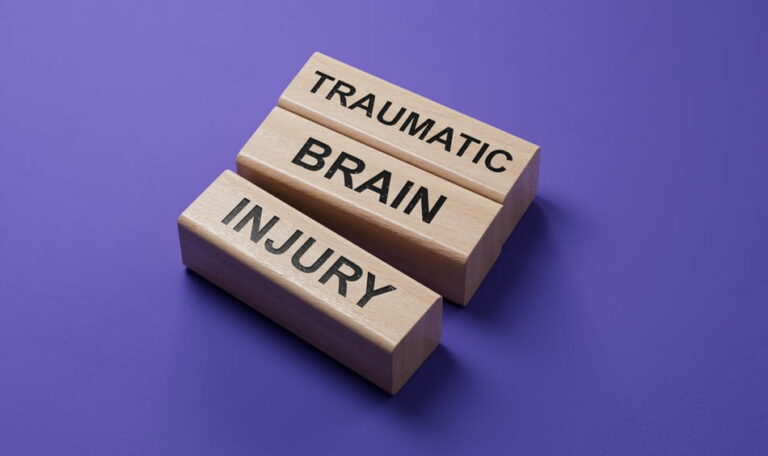 Wooden blocks spelling traumatic brain injury for a Colorado concussion claim article