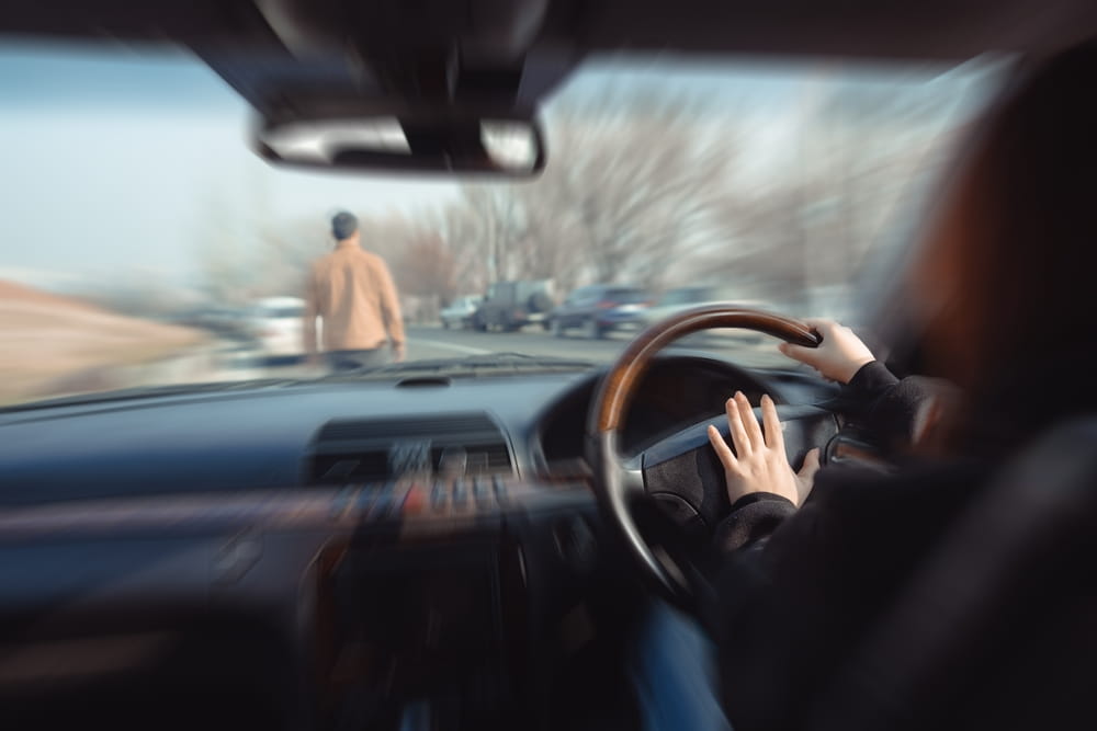 Driver's view of a pedestrian ahead, illustrating driver duty of care under Colorado law