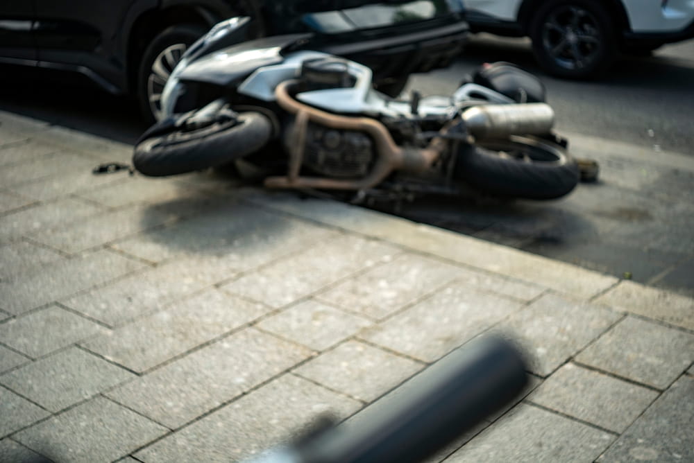 Motorcycle lying in the road after a Grand Junction crash