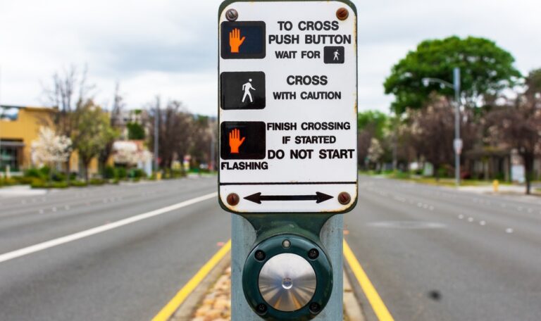 Pedestrian crosswalk and walk signal in Austin, where right-of-way rules shape pedestrian accident claims